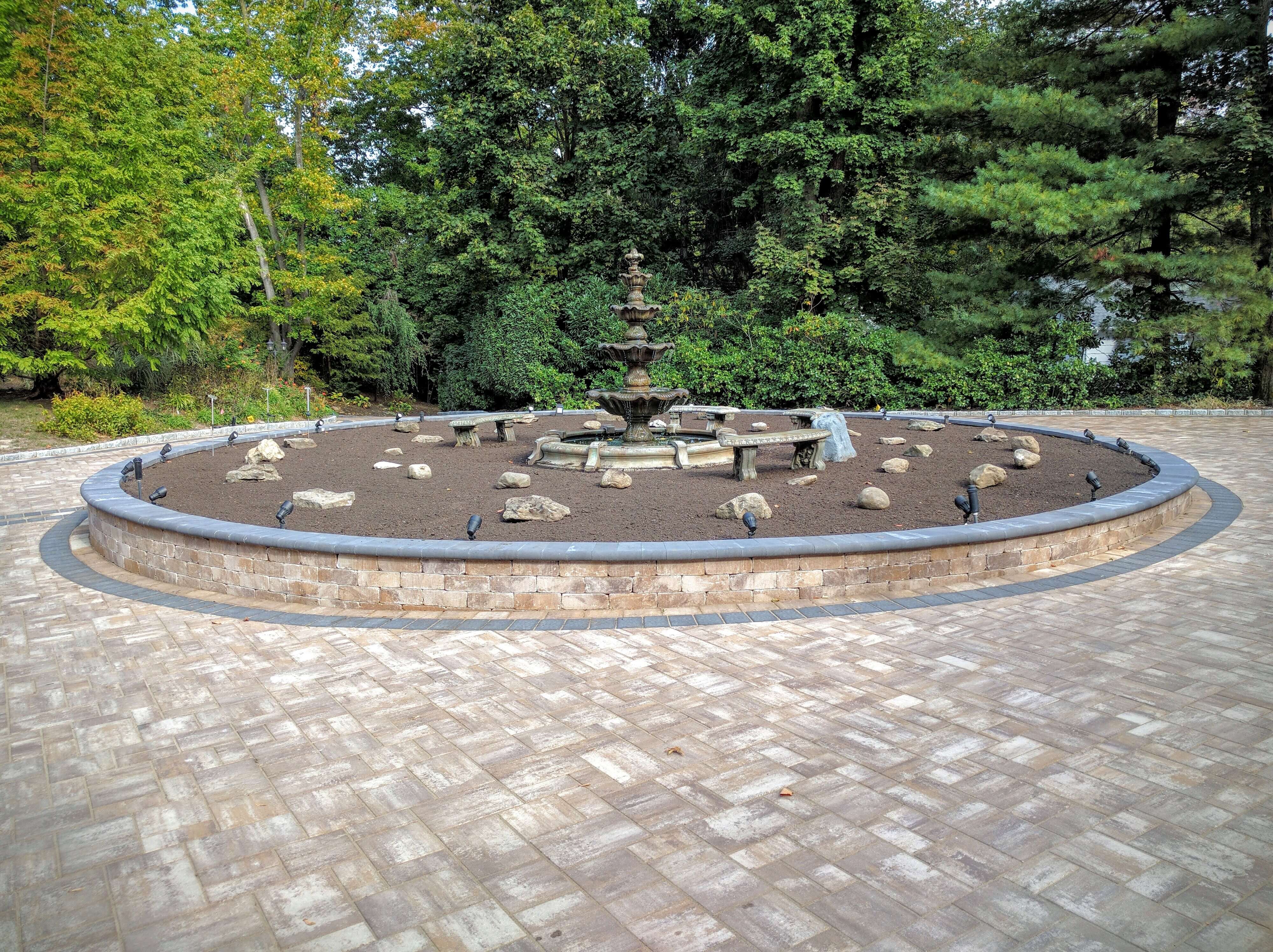 Luxury stone waterfall Long Island natural stone water feature high end landscape design